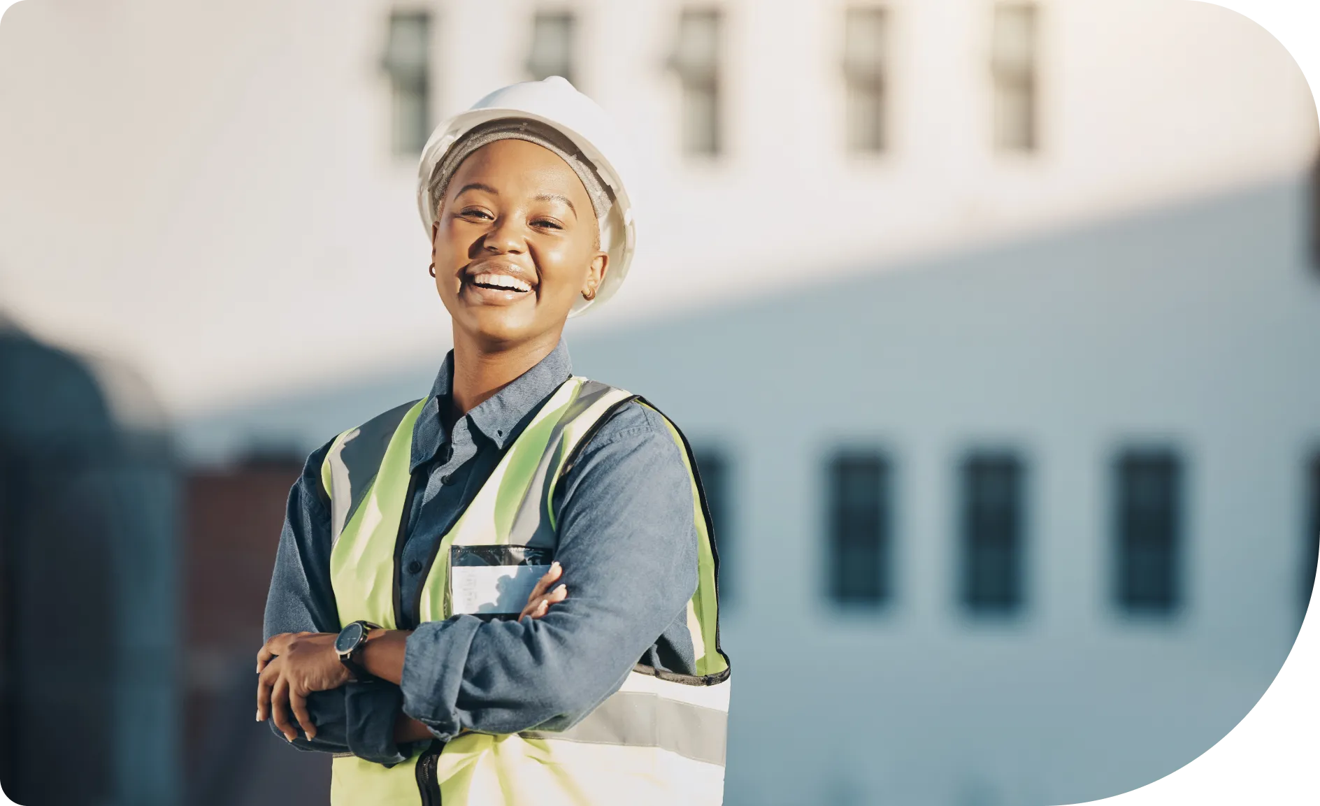 Happy, smiling professional lady wearing a construction hat and protective clothing